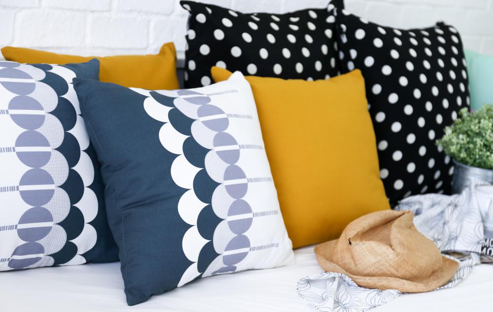 Throw pillows should complement a room's decor.