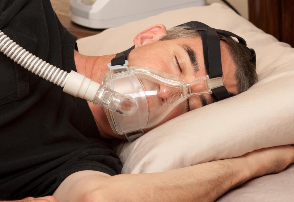A CPAP pillow accommodates the CPAP device to ensure proper positioning.