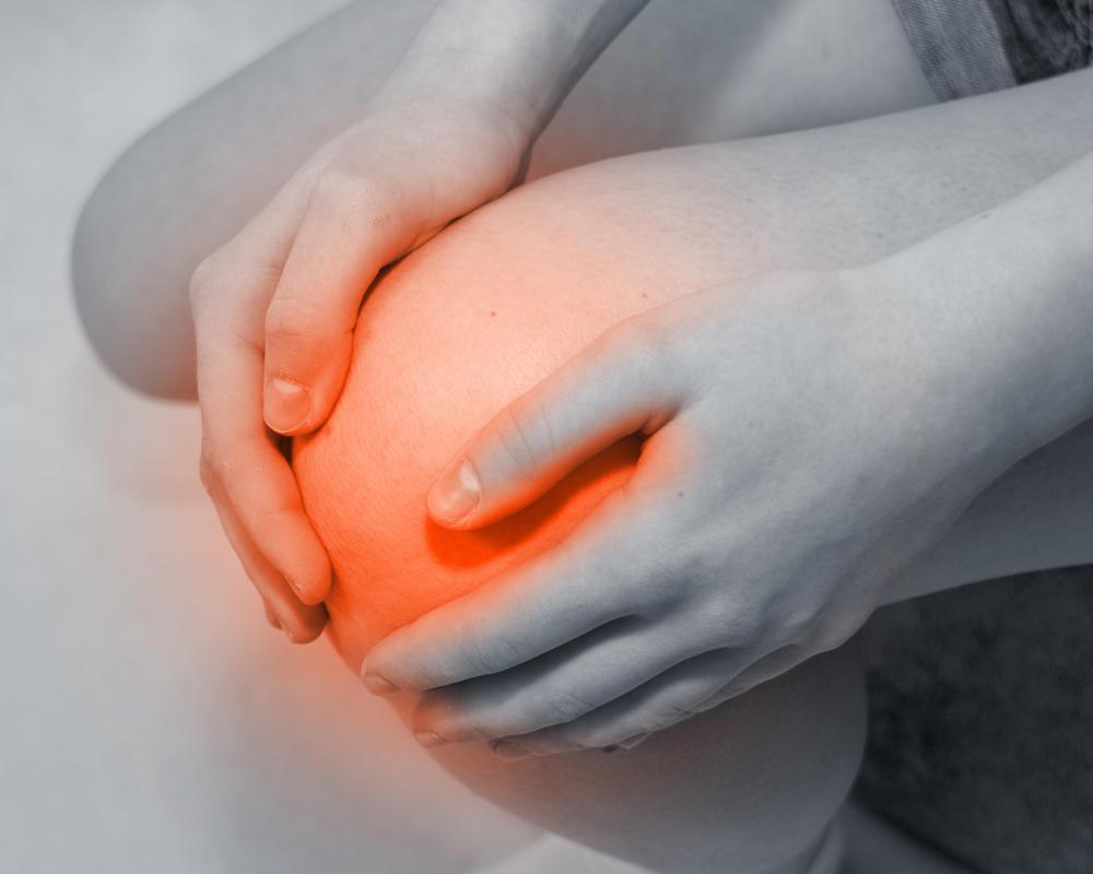 An orthopedic knee pillow may ease pain at night.